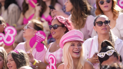 People pose in the crowd prior to the premiere of "Barbie" on Sunday, July 9, 2023, at The Shrine Auditorium in Los Angeles. (AP Photo/Chris Pizzello)